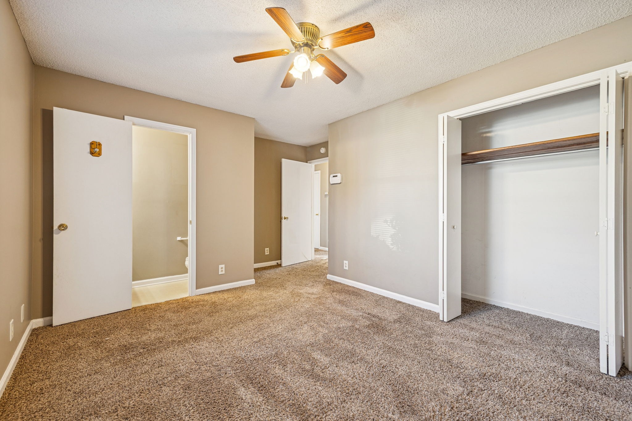 730 Inver Lane Clarksville, TN 37042 - Photo 22 of 32 a view of a big room with closet and a chandelier fan