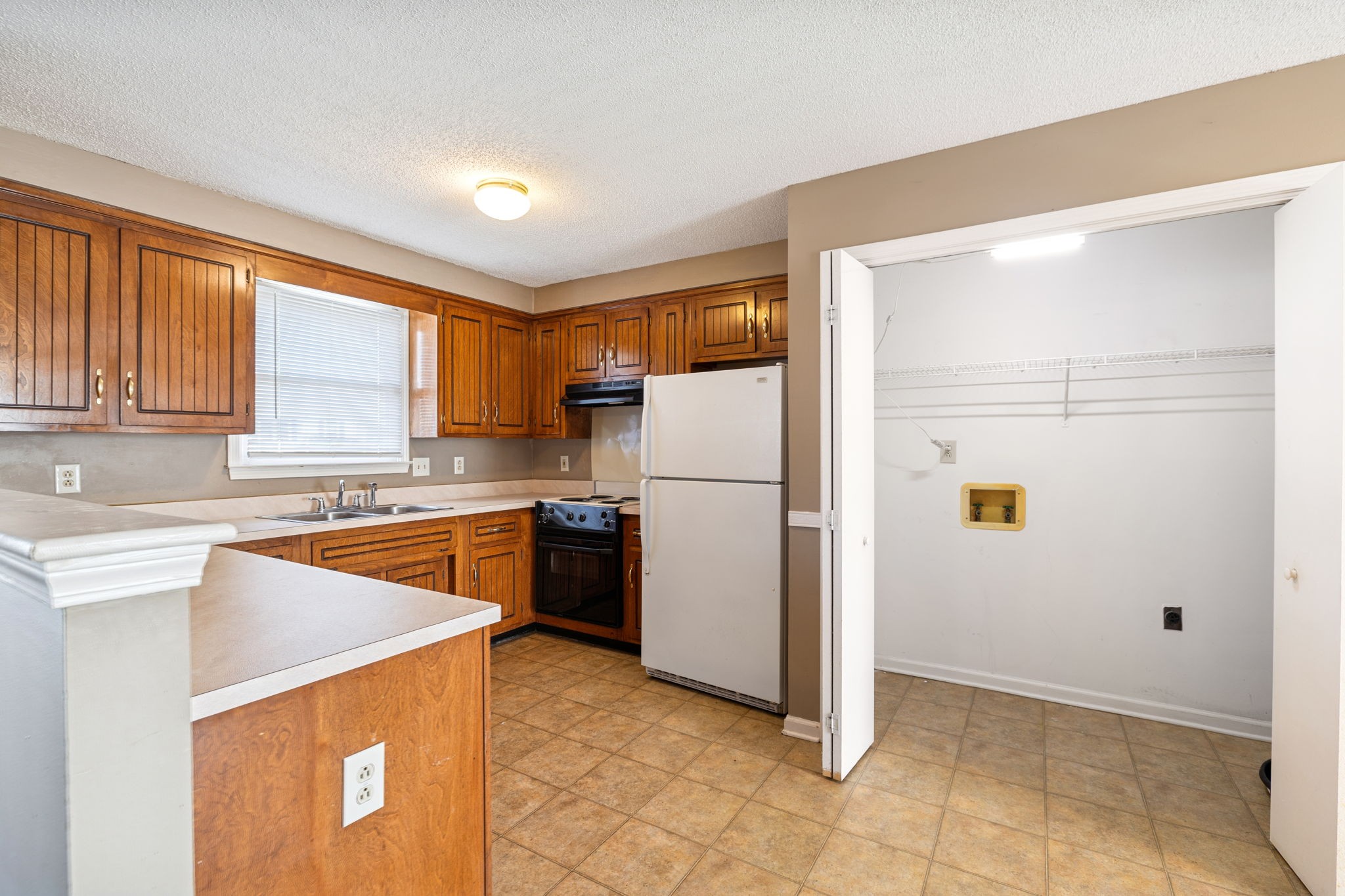 730 Inver Lane Clarksville, TN 37042 - Photo 8 of 32 a kitchen with a refrigerator a stove top oven a sink and dishwasher