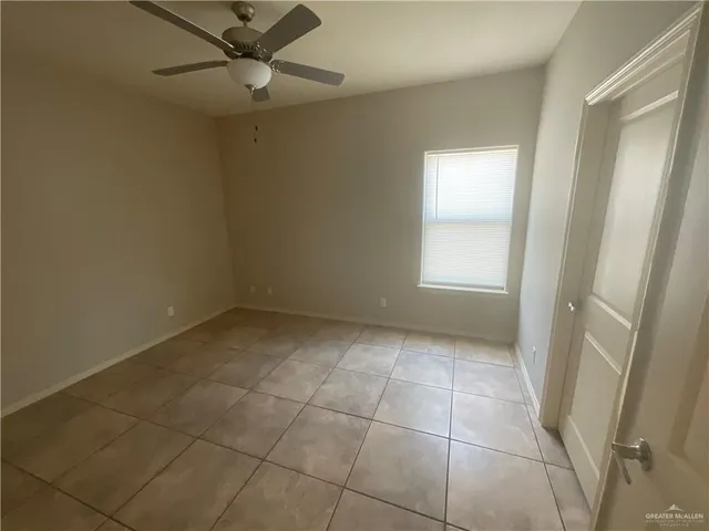 a view of an empty room and a windows