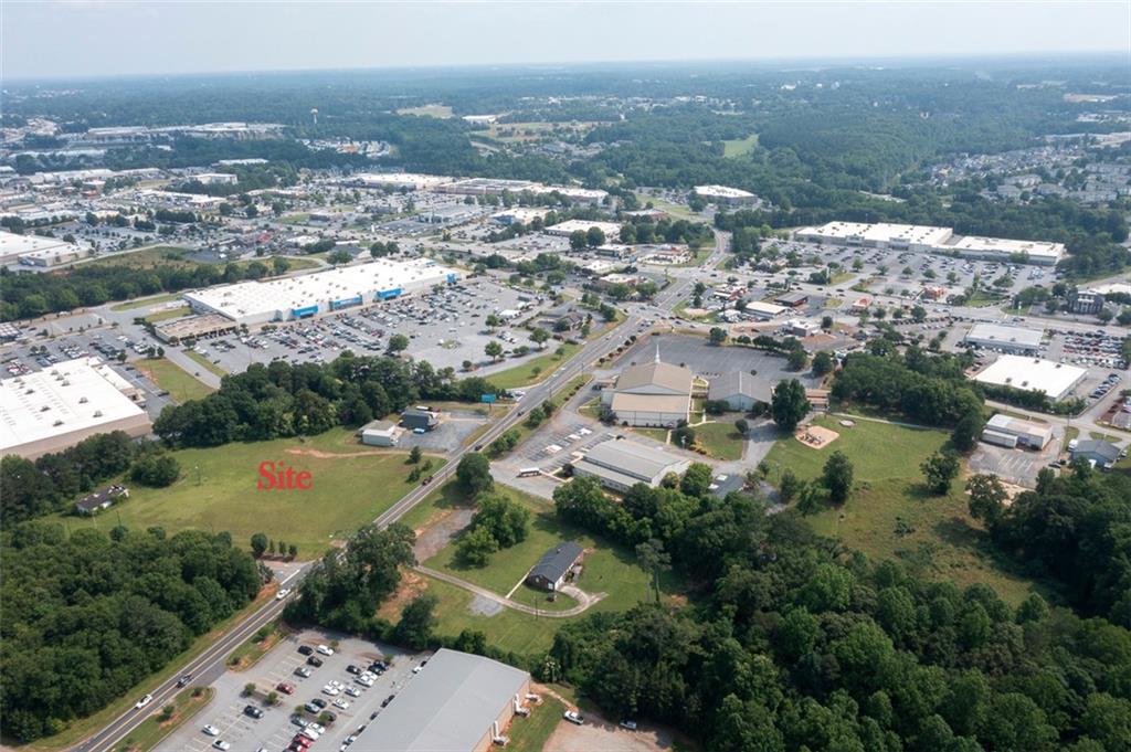 222 Brown Road Anderson, SC 29621 - Photo 9 of 12 An aerial panorama showcases a prime development site surrounded by established retail centers and residential areas.