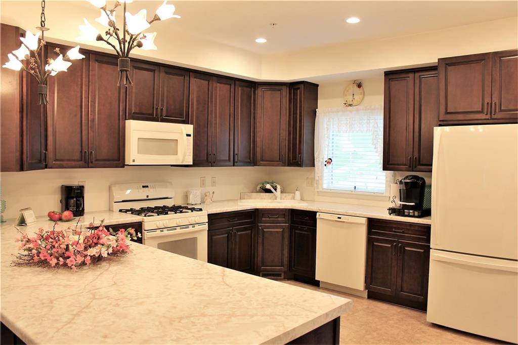 307 Wineberry Ridge Court Irwin, PA 15642 - Photo 4 of 18 Spacious kitchen with tons of customized cabinets and all upgraded appliances.