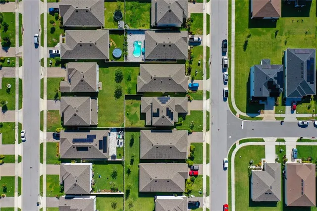 an aerial view of houses and roads