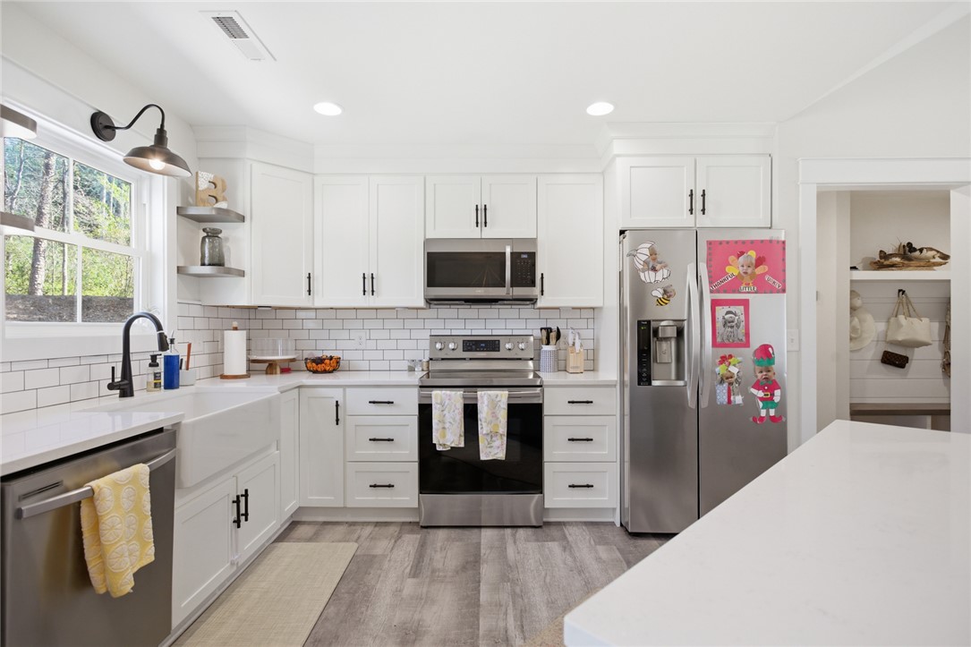 119 Brook Lane Seneca, SC 29672 - Photo 12 of 43 This bright kitchen features sleek appliances and ample counter space for culinary endeavors.