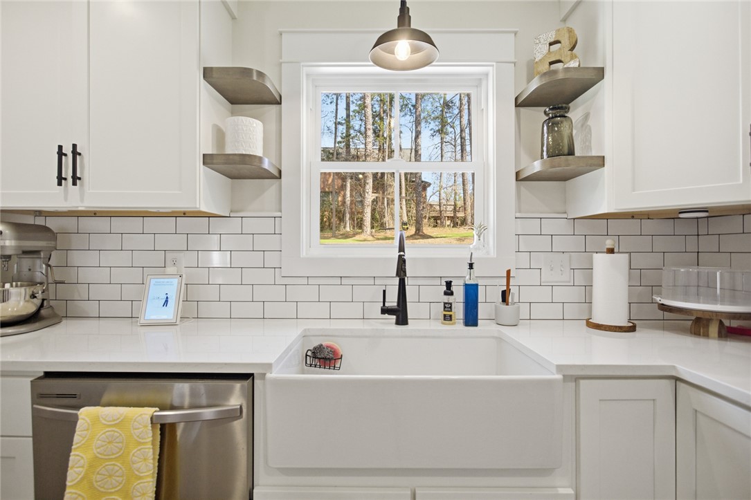 119 Brook Lane Seneca, SC 29672 - Photo 13 of 43 This bright kitchen features classic subway tile and a spacious farmhouse sink.