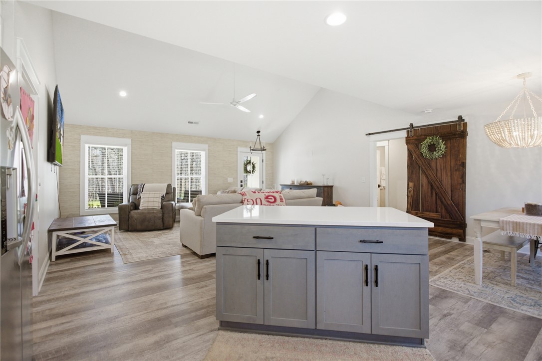 119 Brook Lane Seneca, SC 29672 - Photo 14 of 43 This bright, airy interior features vaulted ceilings and light flooring, creating an inviting atmosphere.