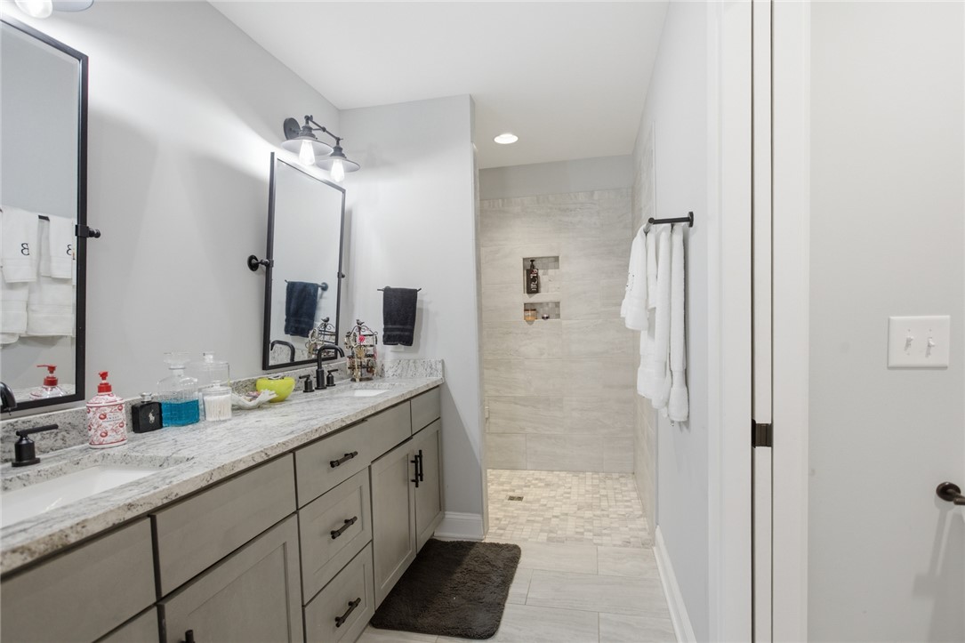 119 Brook Lane Seneca, SC 29672 - Photo 18 of 43 This spacious bathroom offers a walk-in shower and ample counter space for daily routines.