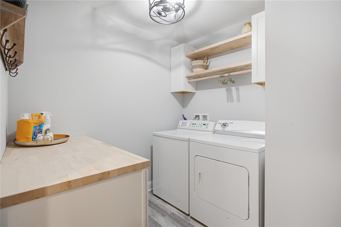 119 Brook Lane Seneca, SC 29672 - Photo 21 of 43 This dedicated laundry space combines efficiency with smart storage solutions.