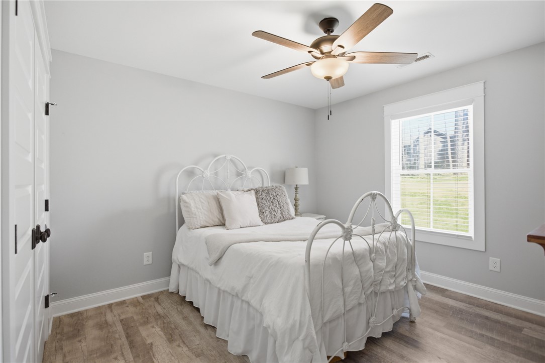119 Brook Lane Seneca, SC 29672 - Photo 23 of 43 This serene bedroom offers ample light and comfortable flooring for peaceful living.