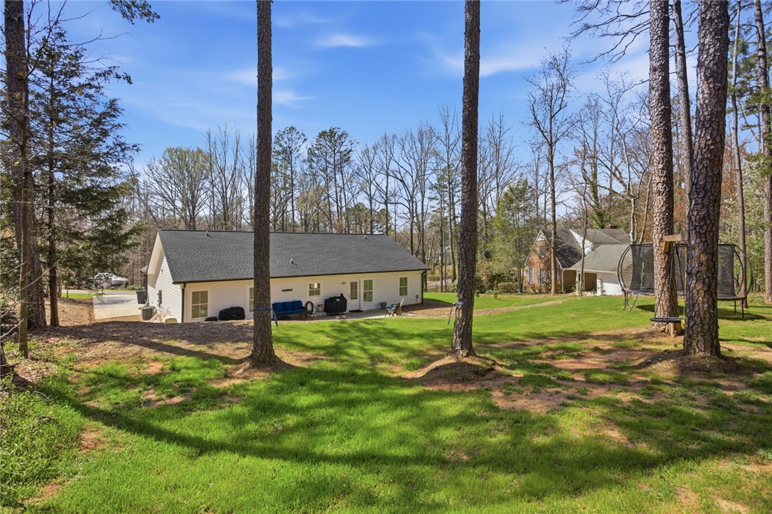 119 Brook Lane Seneca, SC 29672 - Photo 32 of 43 This spacious backyard offers ample room for recreation and outdoor enjoyment.