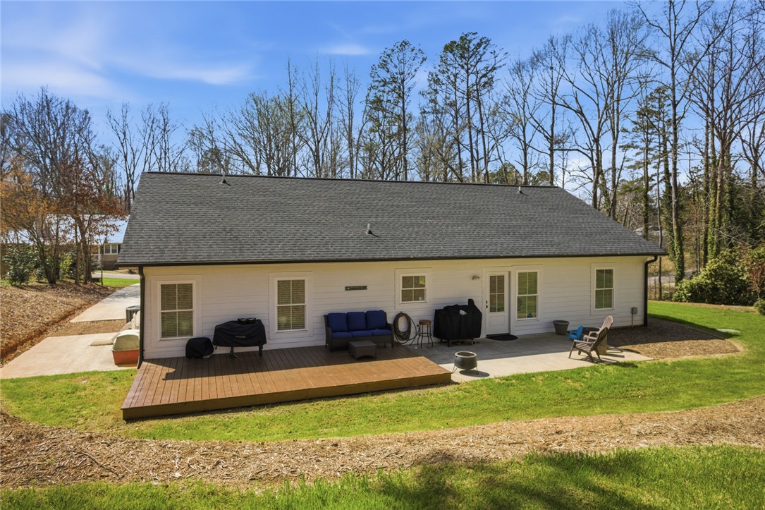 119 Brook Lane Seneca, SC 29672 - Photo 33 of 43 This ranch-style home features a spacious deck and concrete patio, perfect for outdoor enjoyment.