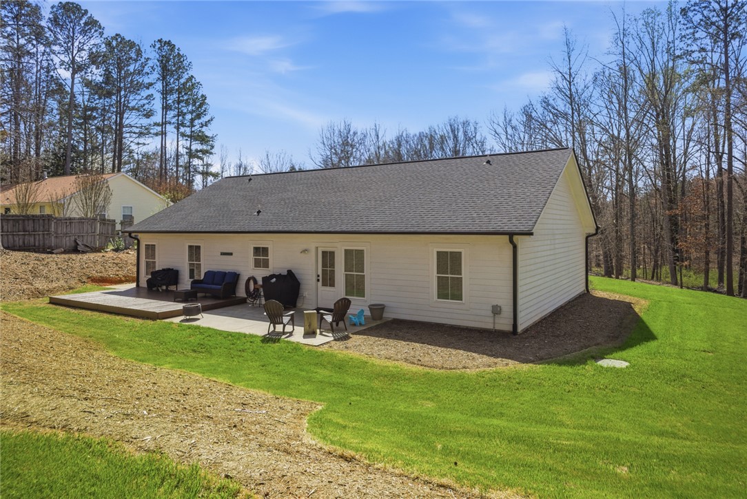 119 Brook Lane Seneca, SC 29672 - Photo 34 of 43 This outdoor space features a combination of concrete and wooden patios, perfect for relaxation and entertaining.