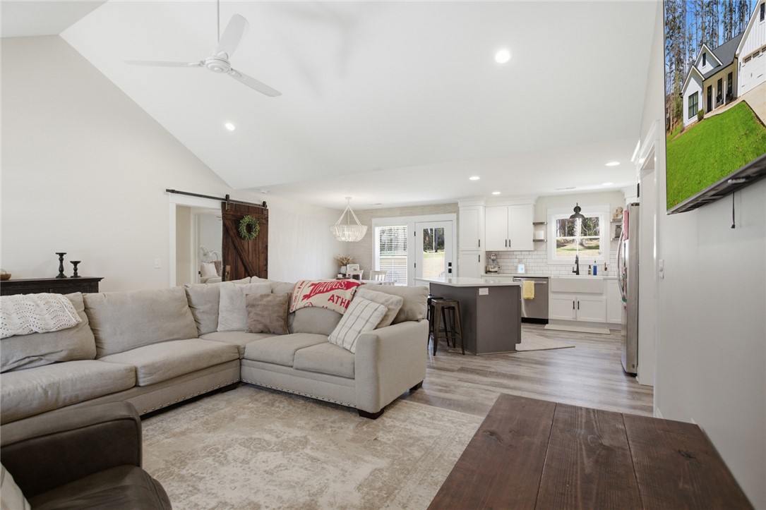 119 Brook Lane Seneca, SC 29672 - Photo 8 of 43 This bright and airy living space flows seamlessly into a well-appointed kitchen, perfect for everyday living.