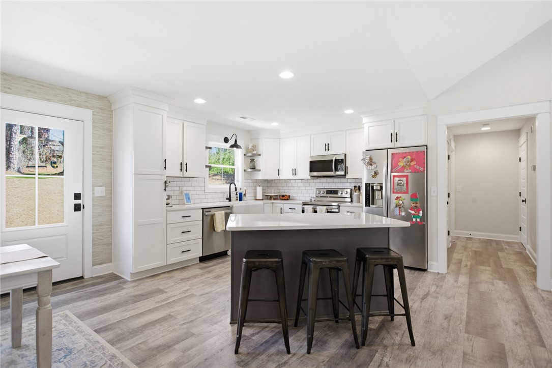 119 Brook Lane Seneca, SC 29672 - Photo 10 of 43 This bright kitchen features modern appliances and a functional island, perfect for casual dining and entertaining.