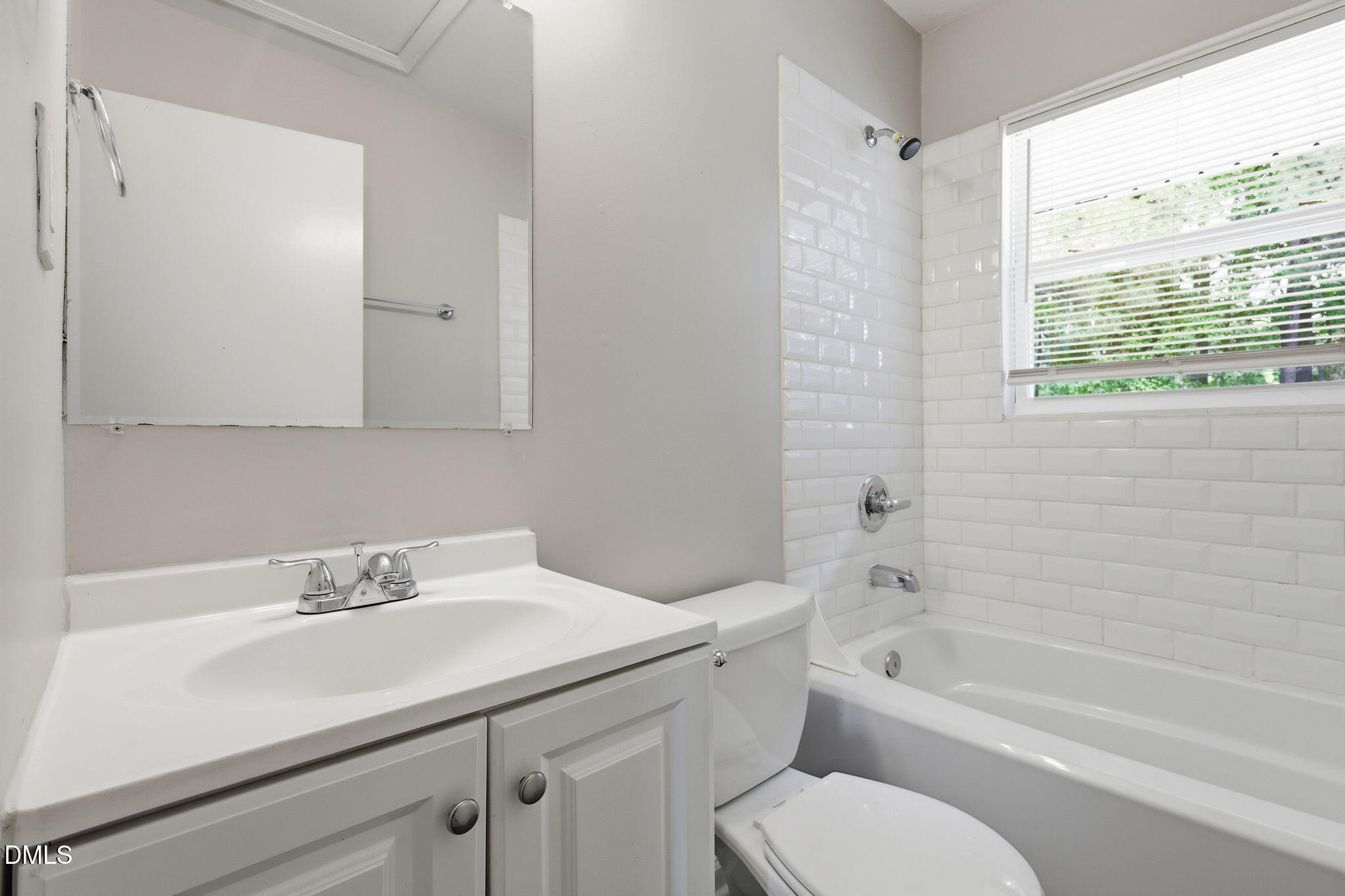 613 Juno Court Raleigh, NC 27610 - Photo 19 of 29 a bathroom with a sink toilet a vanity and bathtub