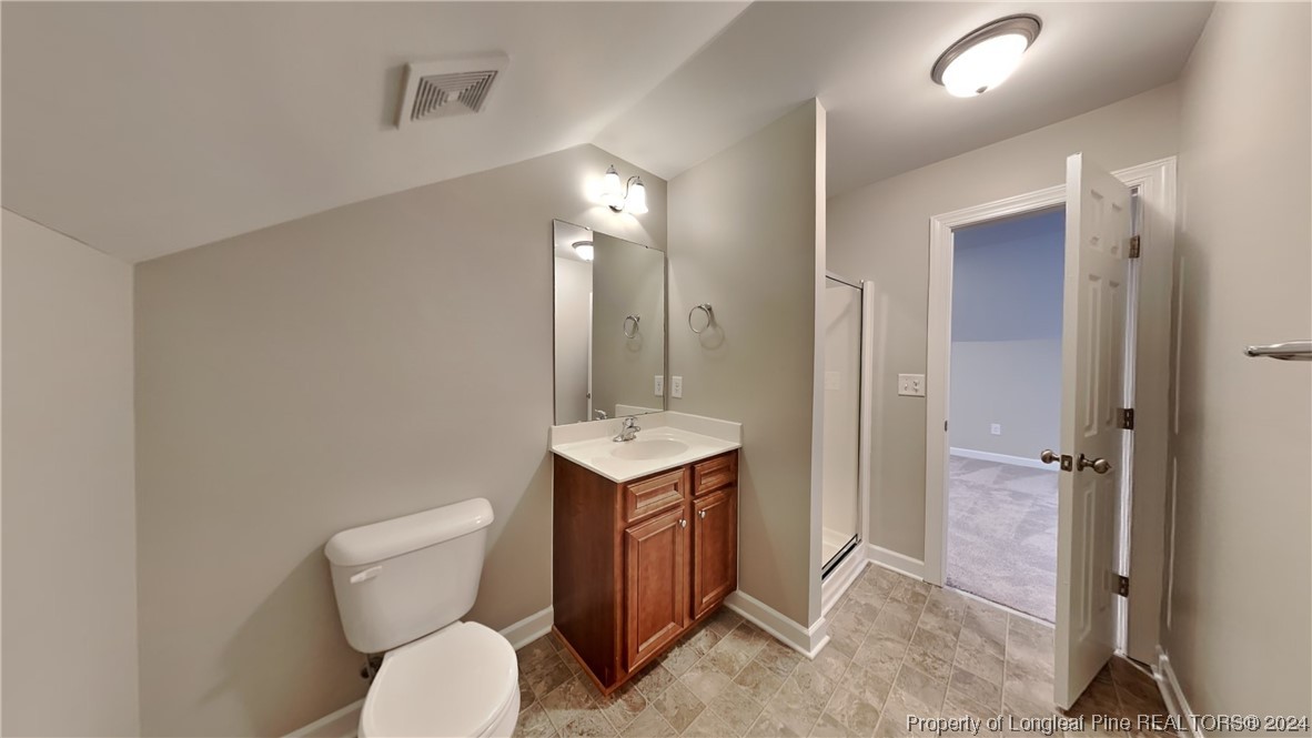 34 Huzzas Circle Cameron, NC 28326 - Photo 13 of 15 a bathroom with a toilet sink and mirror