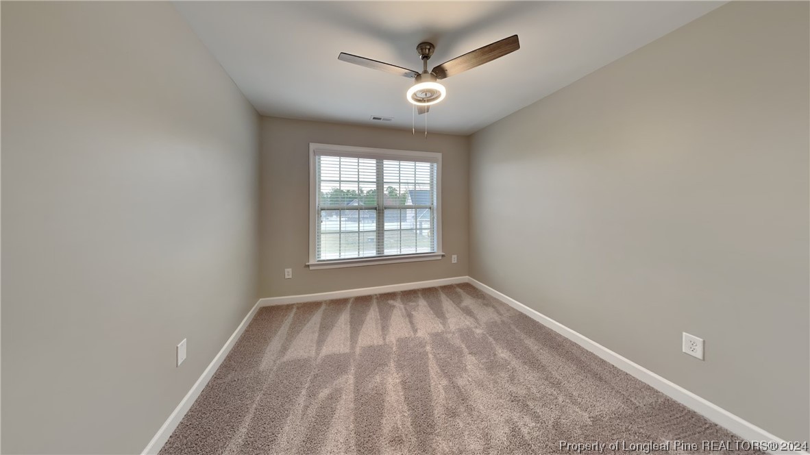 34 Huzzas Circle Cameron, NC 28326 - Photo 10 of 15 wooden floor in an empty room with a window
