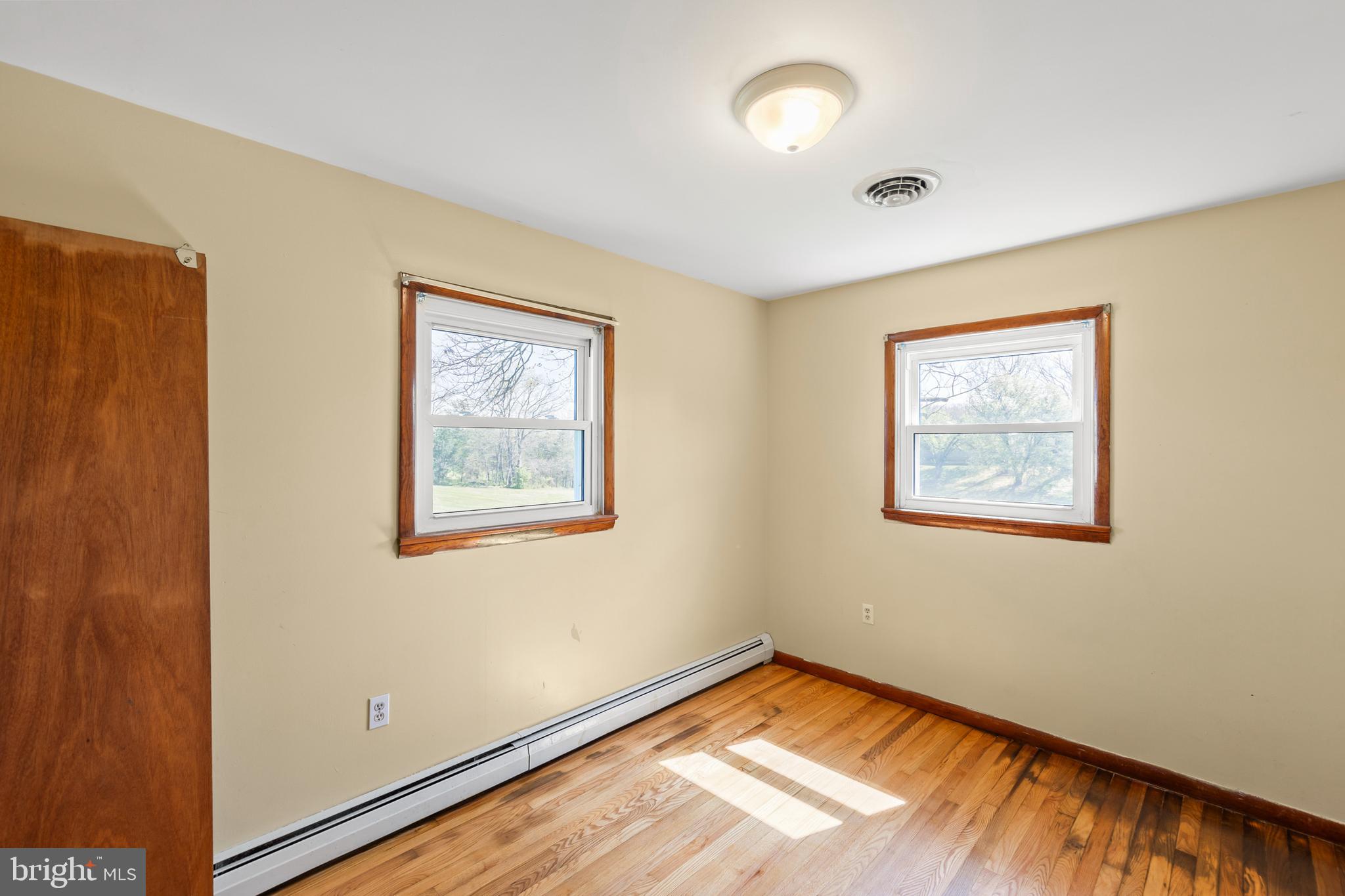 1156 Salem Church Road Stephens City, VA 22655 - Photo 14 of 37 a view of an empty room with window and wooden floor
