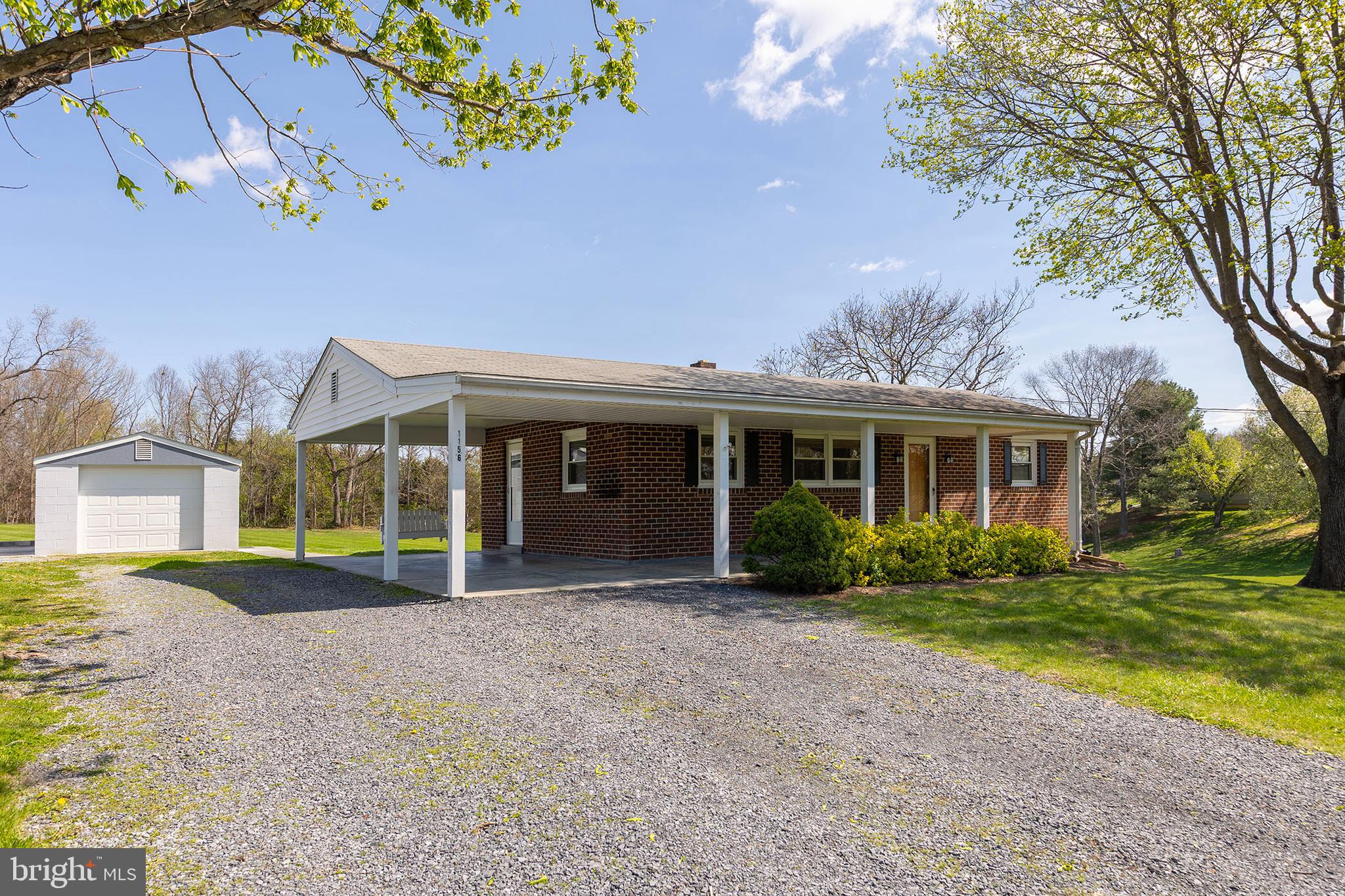 1156 Salem Church Road Stephens City, VA 22655 - Photo 27 of 37 a front view of a house with a yard and potted plants
