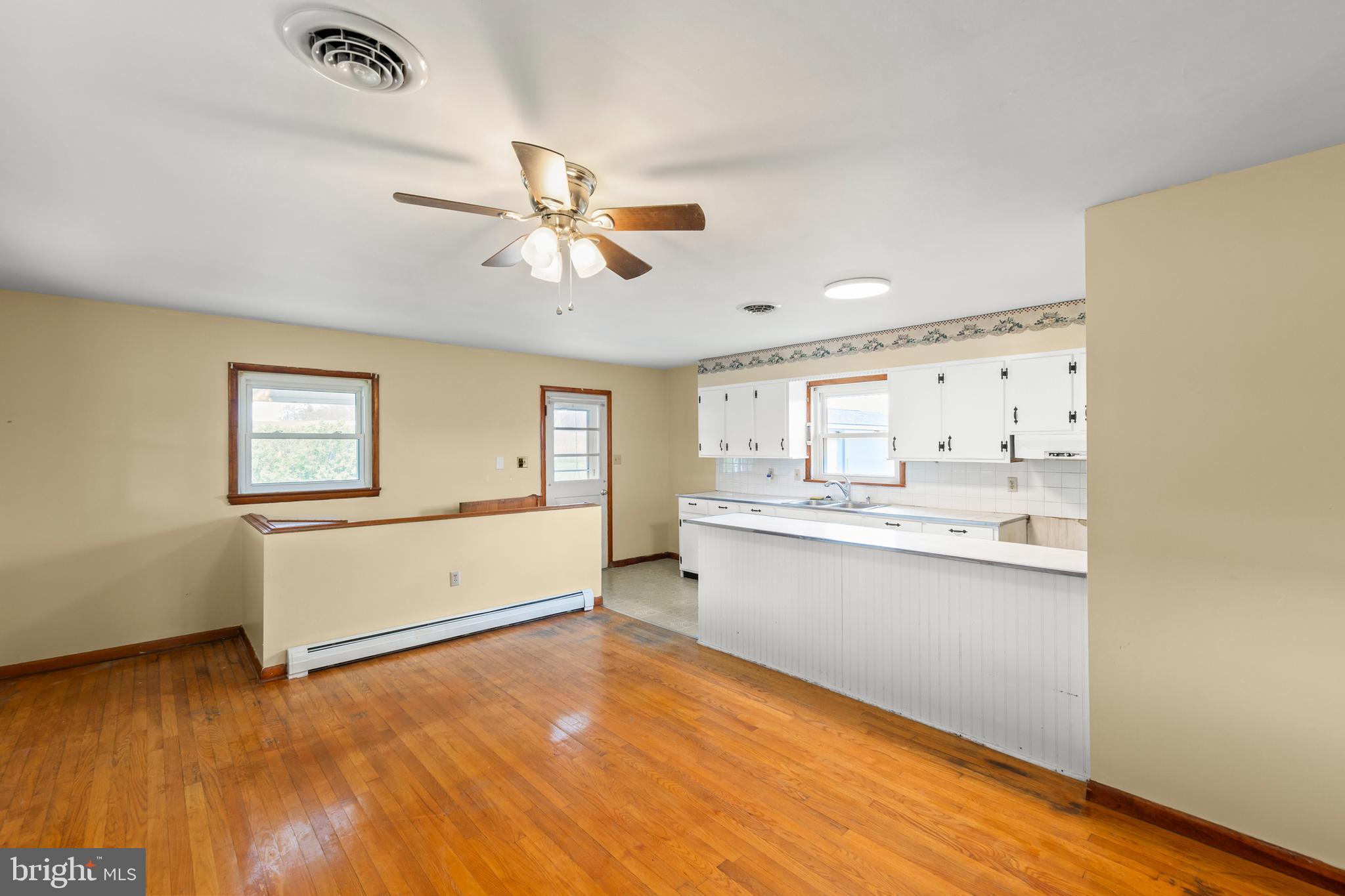 1156 Salem Church Road Stephens City, VA 22655 - Photo 3 of 37 a room with window wooden floor and ceiling fan