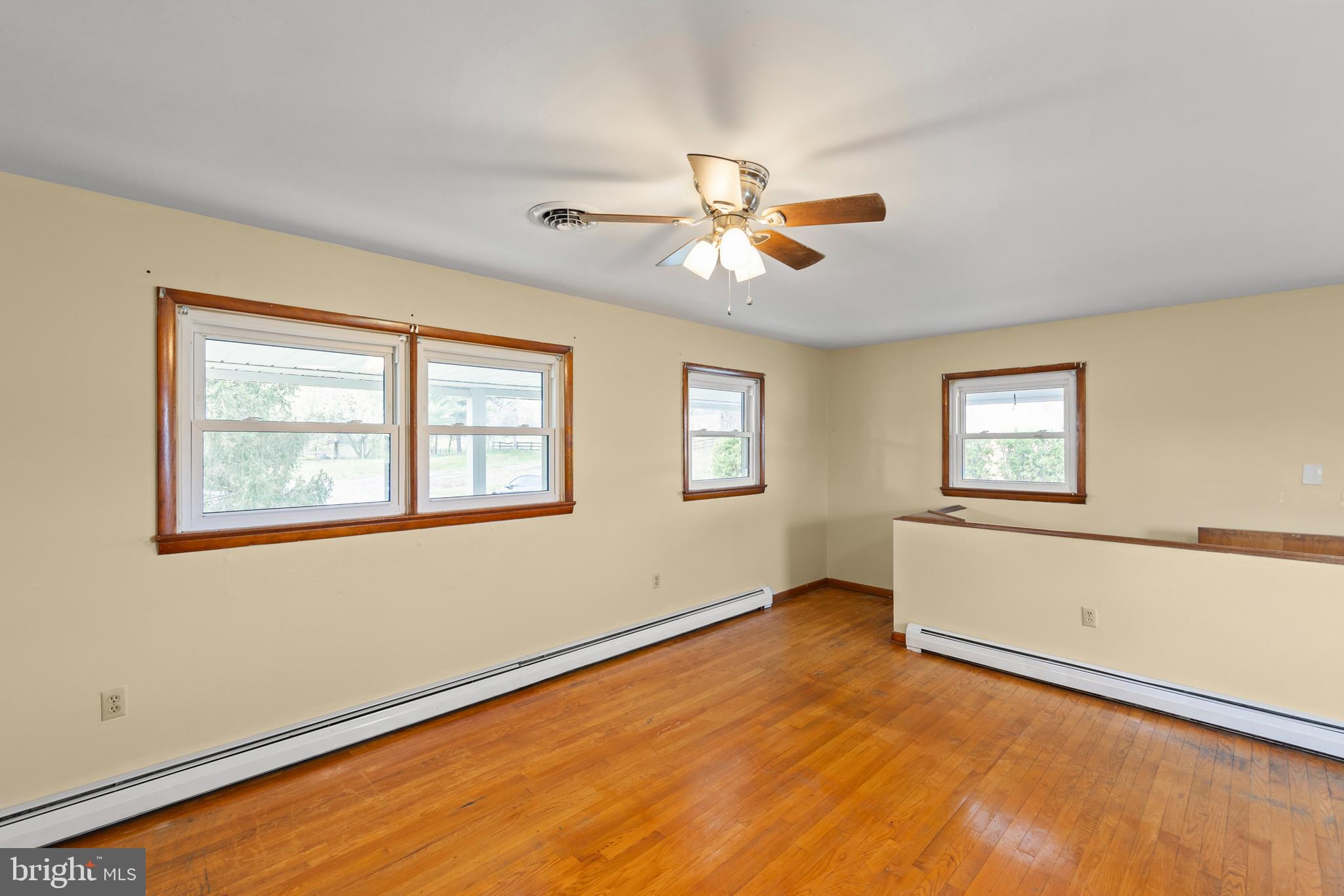 1156 Salem Church Road Stephens City, VA 22655 - Photo 4 of 37 a view of empty room with wooden floor and fan