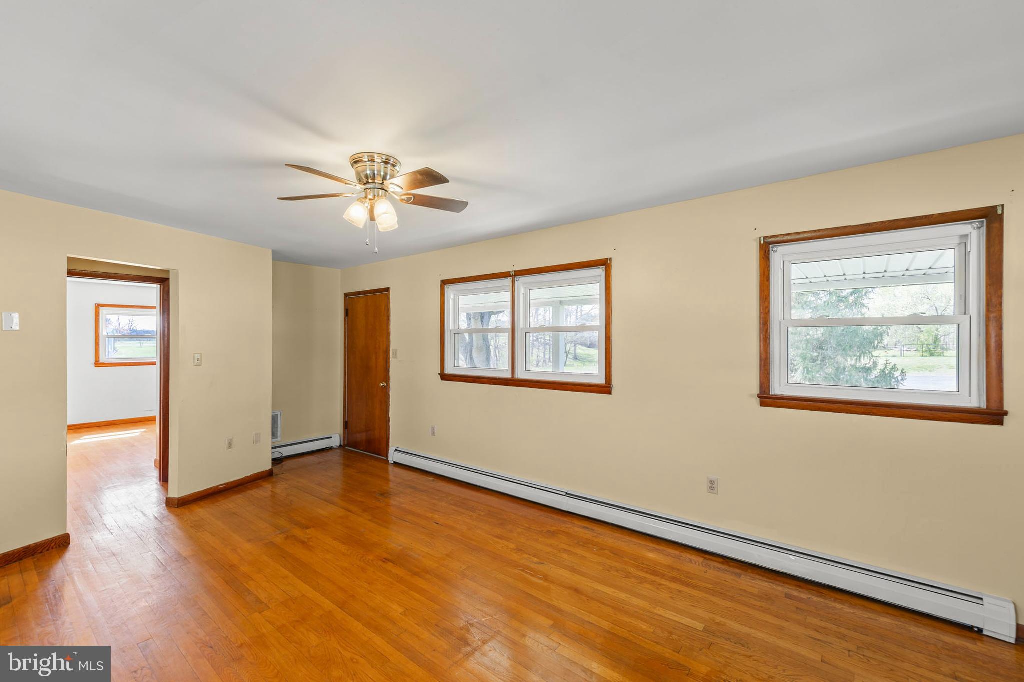 1156 Salem Church Road Stephens City, VA 22655 - Photo 6 of 37 a view of an empty room with window and wooden floor