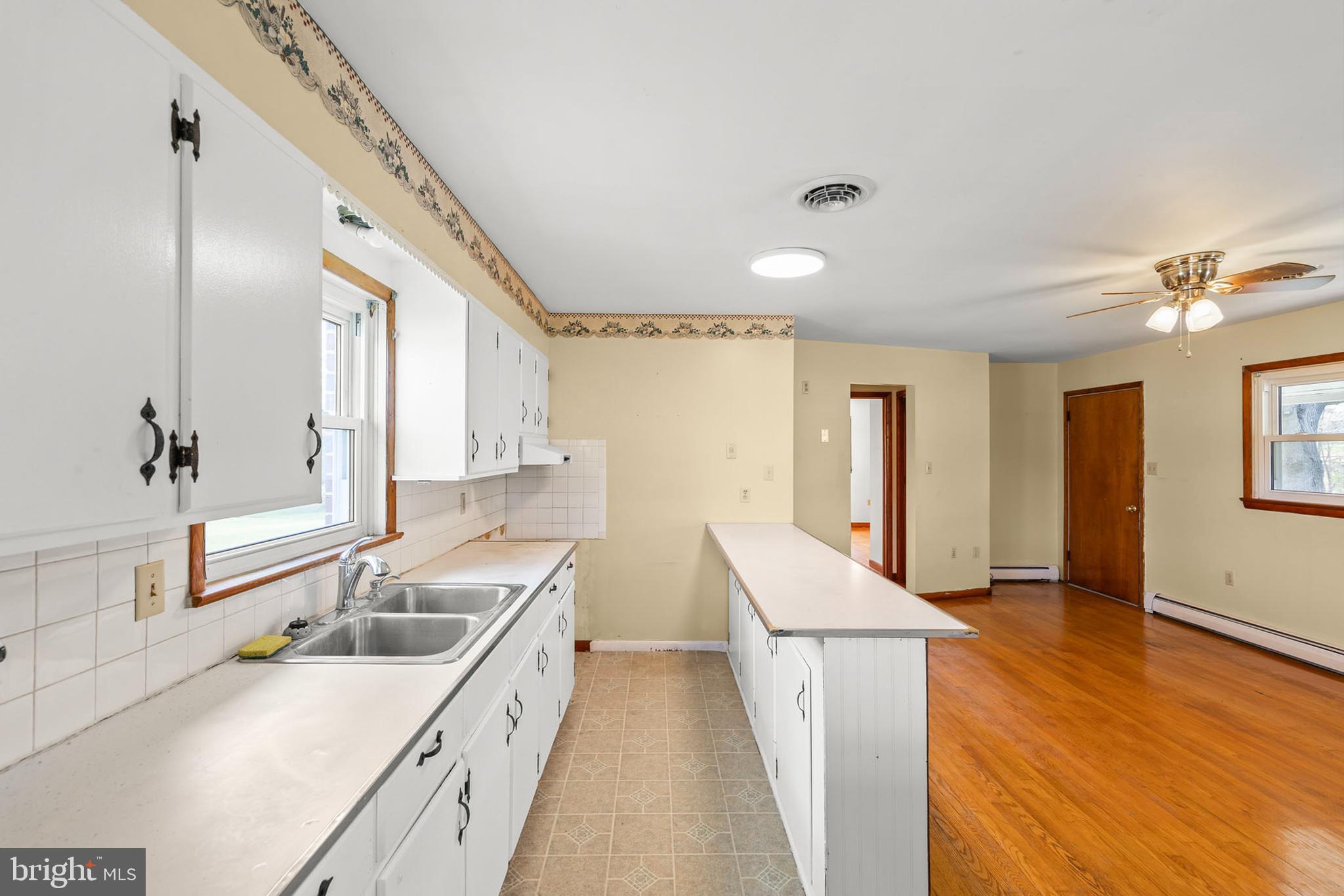 1156 Salem Church Road Stephens City, VA 22655 - Photo 9 of 37 a kitchen with a sink and a refrigerator