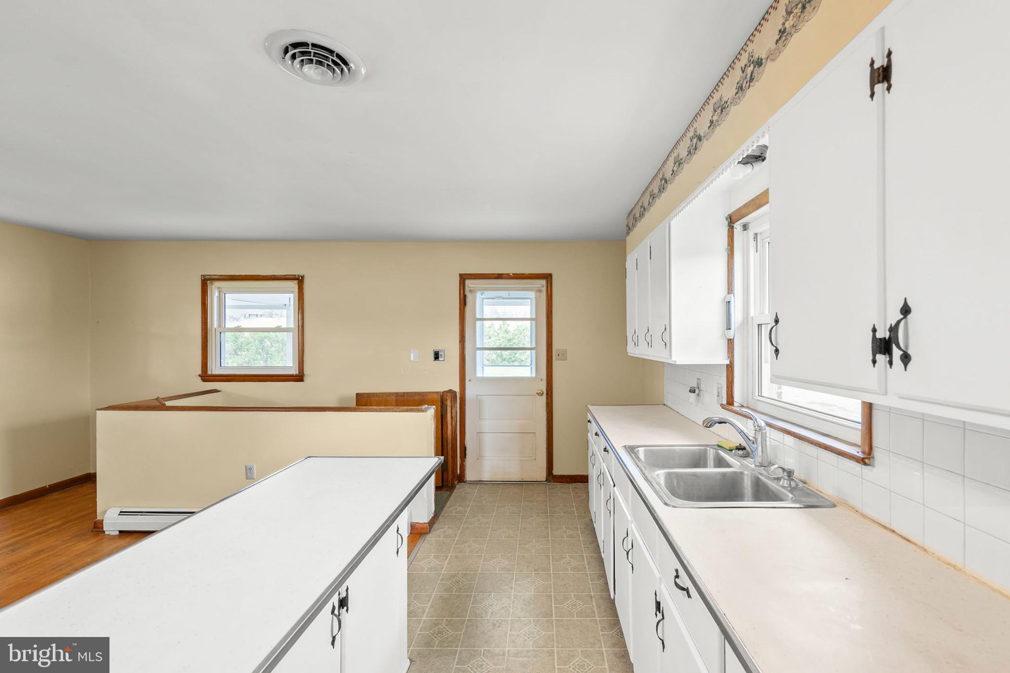 1156 Salem Church Road Stephens City, VA 22655 - Photo 10 of 37 a kitchen with a sink and a refrigerator