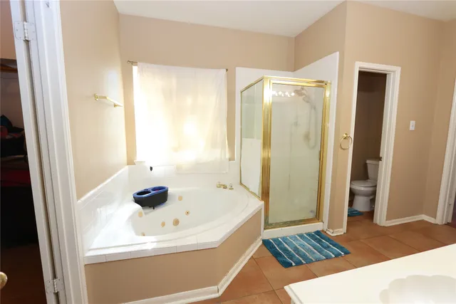 a bathroom with a sink a shower and a bathtub