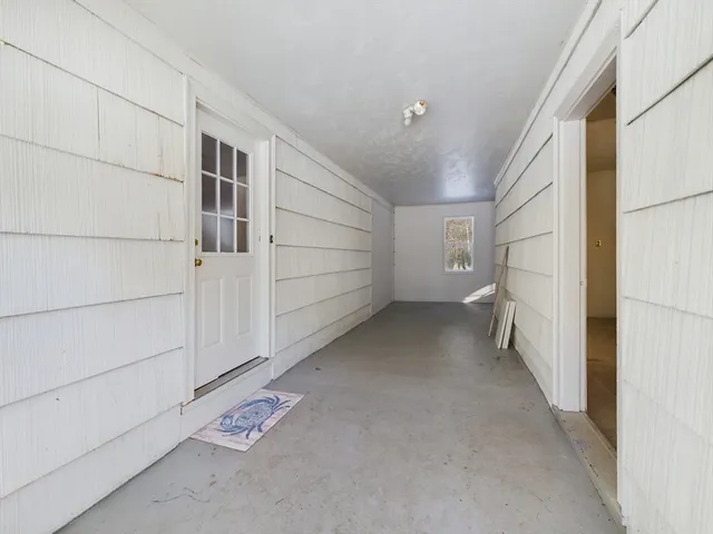 a view of a room with white walls