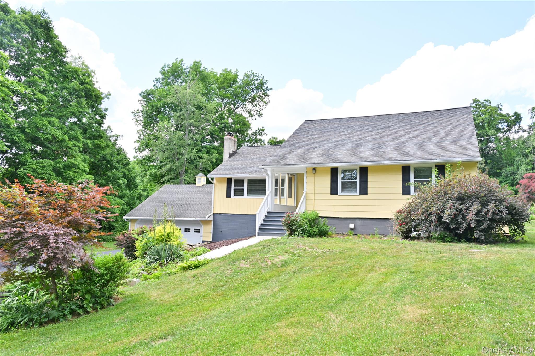 136 Foggintown Road Brewster, NY 10509 - Photo 4 of 50 a front view of a house with yard and green space