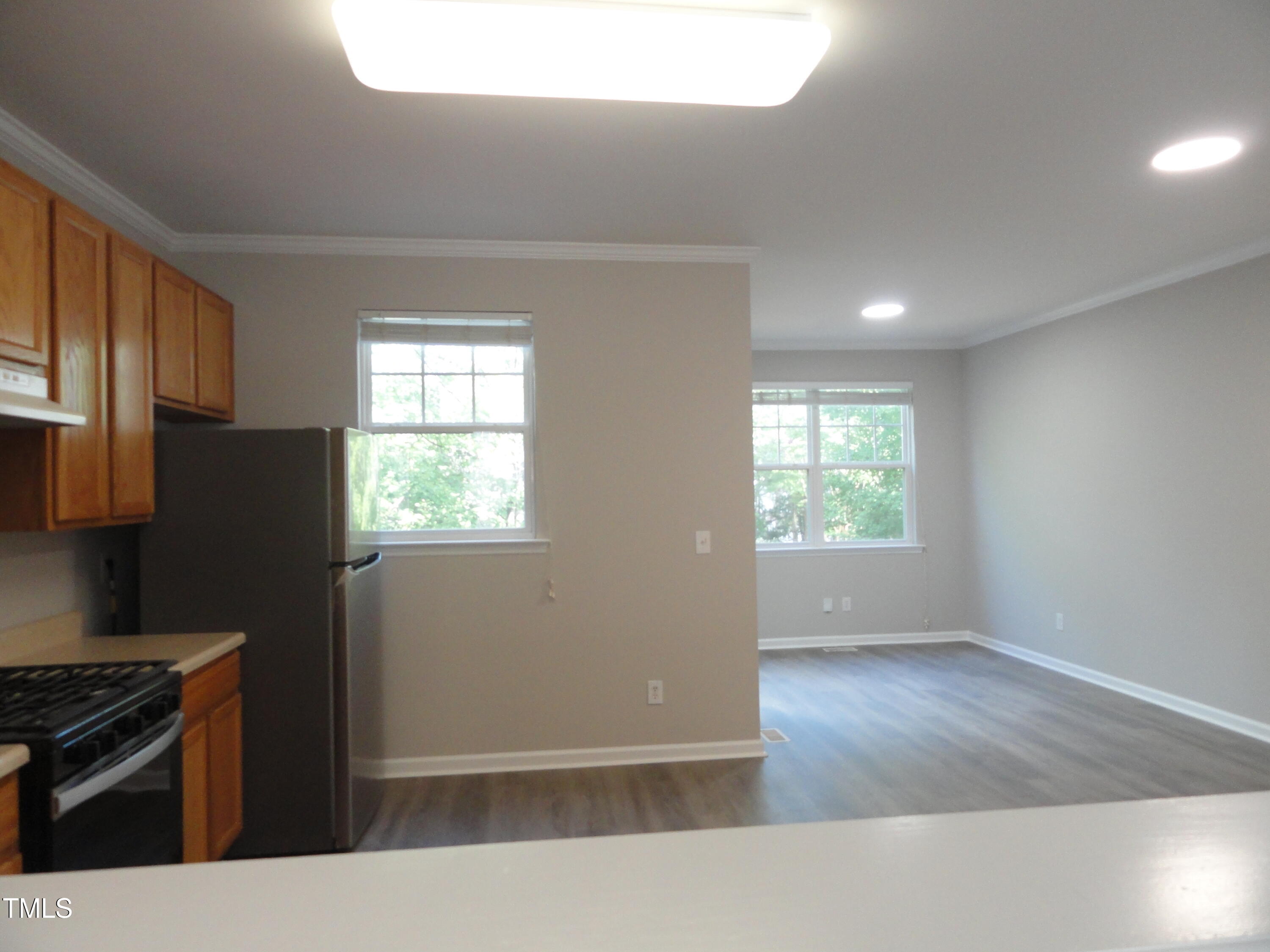 1531 Haywards Heath Lane Apex, NC 27502 - Photo 12 of 25 a kitchen with wooden floor and a stove top oven