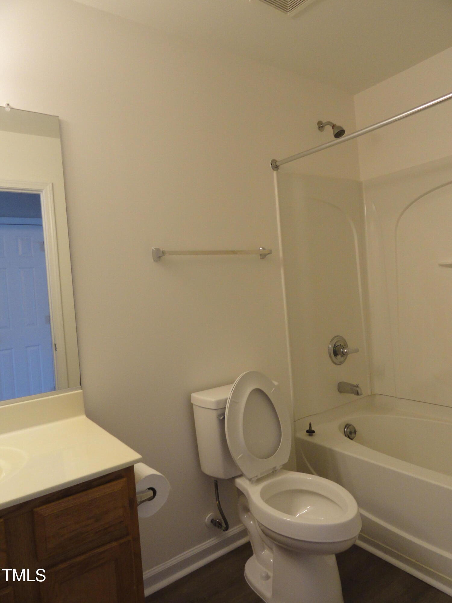 1531 Haywards Heath Lane Apex, NC 27502 - Photo 20 of 25 a white toilet sitting next to a bath tub