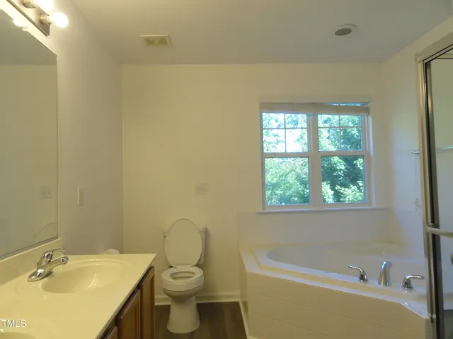 a bathroom with a sink a toilet and a bathtub