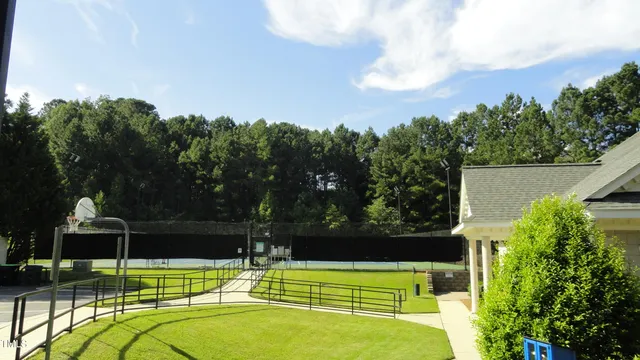 a view of a swimming pool with a yard
