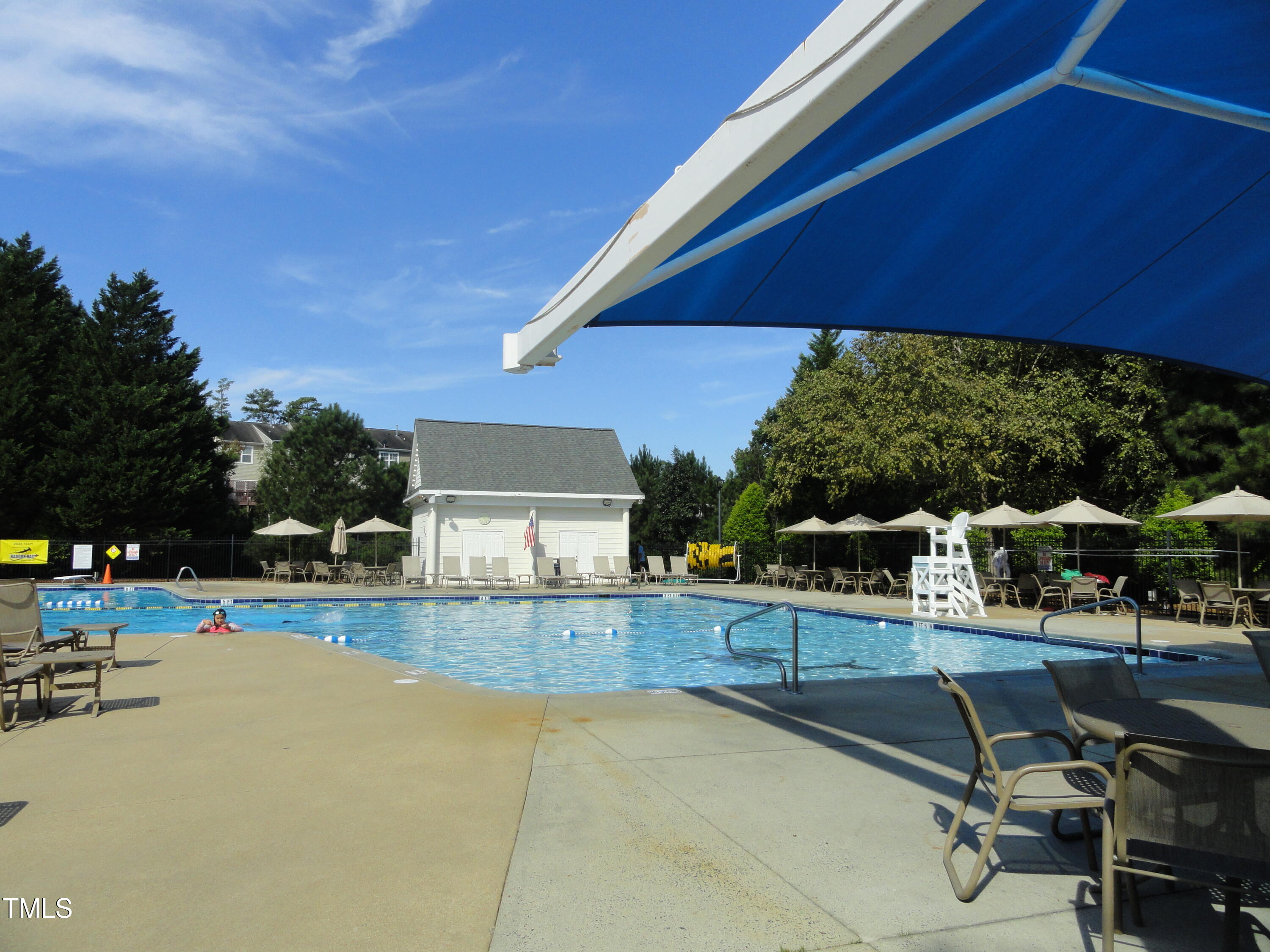 1531 Haywards Heath Lane Apex, NC 27502 - Photo 25 of 25 a view of a patio with table and chairs under an umbrella