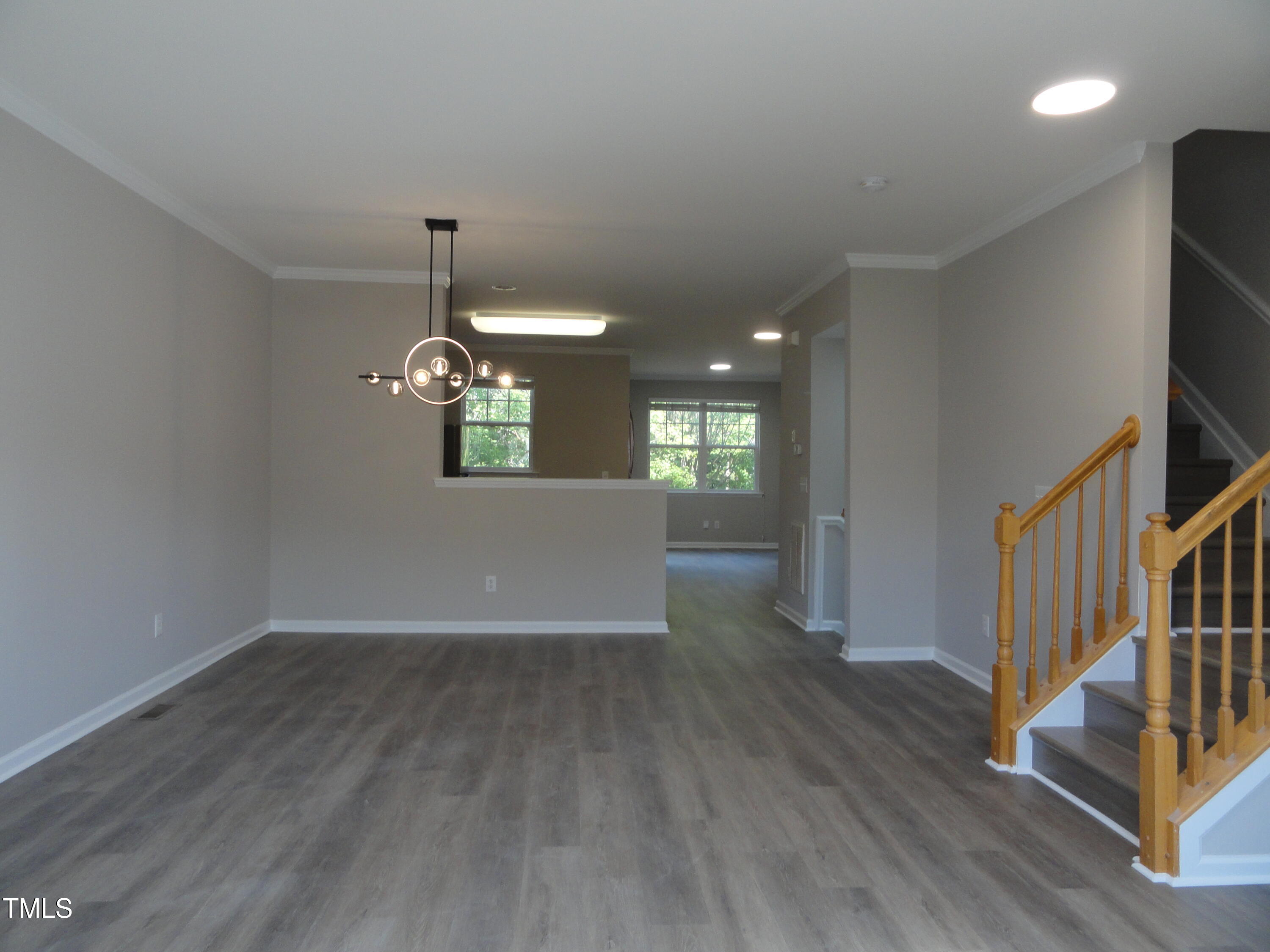 1531 Haywards Heath Lane Apex, NC 27502 - Photo 6 of 25 a view of a room with wooden floor fireplace and windows