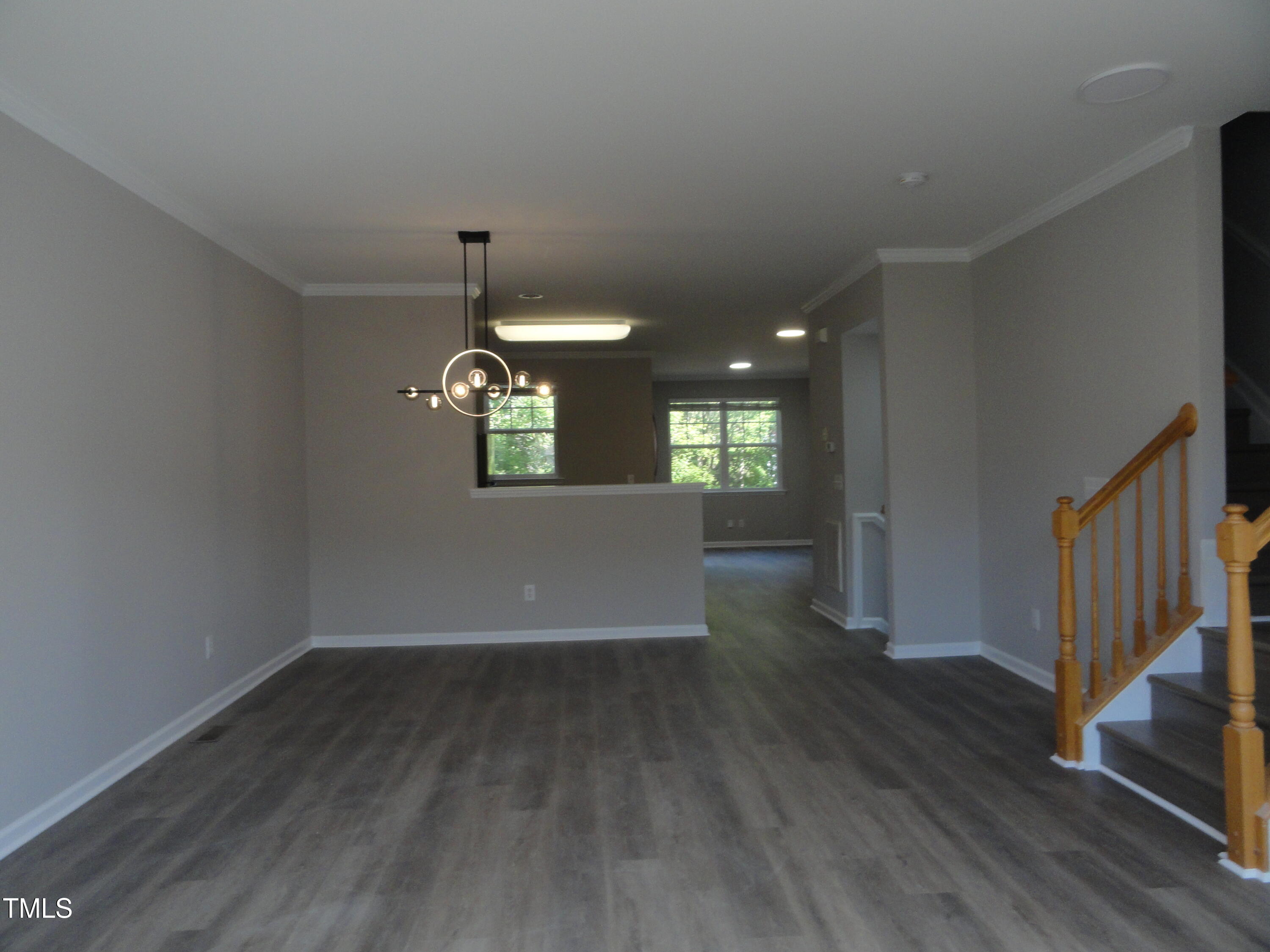1531 Haywards Heath Lane Apex, NC 27502 - Photo 10 of 25 a view of wooden floor and windows in a room