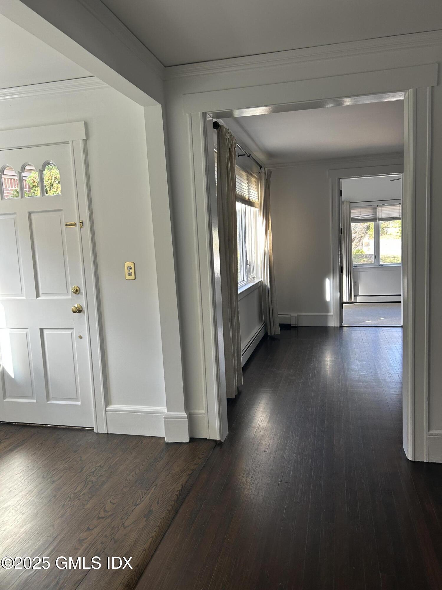 112 East Elm Street, Unit 1 Greenwich, CT 06830 - Photo 15 of 19 wooden floor in an empty room with a window