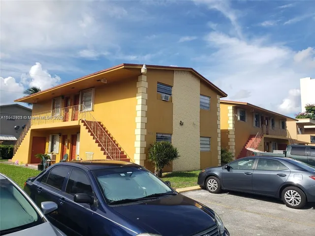a view of a car parked in front of a house