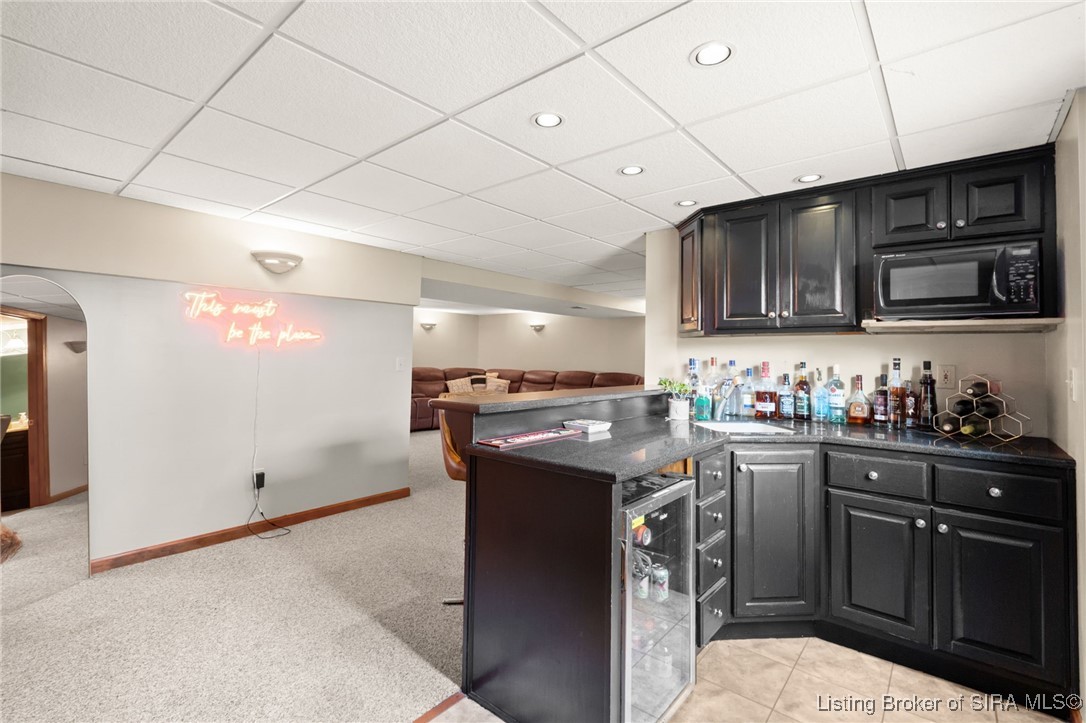 5510 Briarhill Drive Floyds Knobs, IN 47119 - Photo 21 of 88 Wet bar with beverage cooler in basement