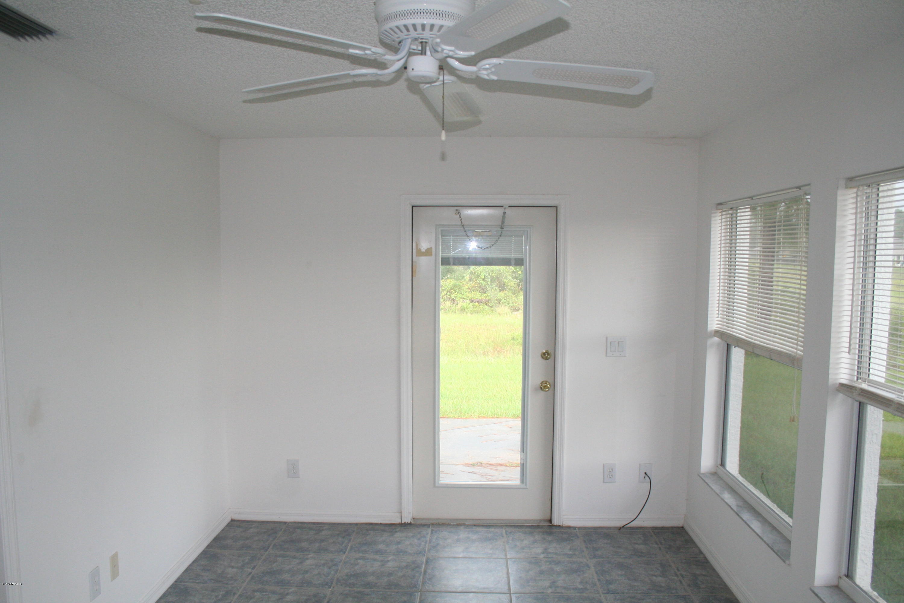 1350 Weiman Road Southeast Palm Bay, FL 32909 - Photo 11 of 12 Enclosed Porch