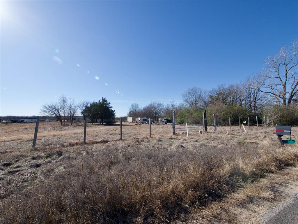 6700 Smoke Lane Scurry, TX 75158 - Photo 8 of 10 a view of a dry yard with trees