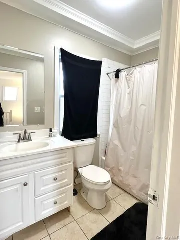 a bathroom with a sink a toilet a mirror and shower
