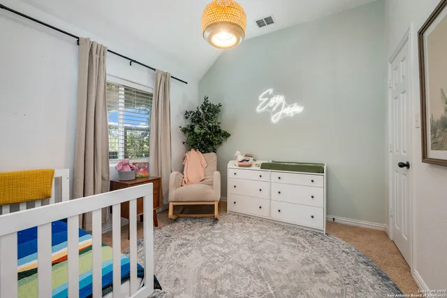 a bedroom with furniture and a window