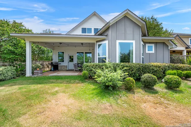 a view of a house with garden and porch