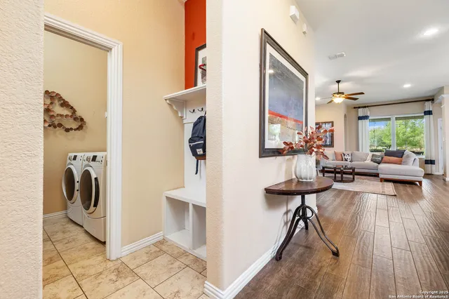 a view of living room kitchen with furniture and a fireplace