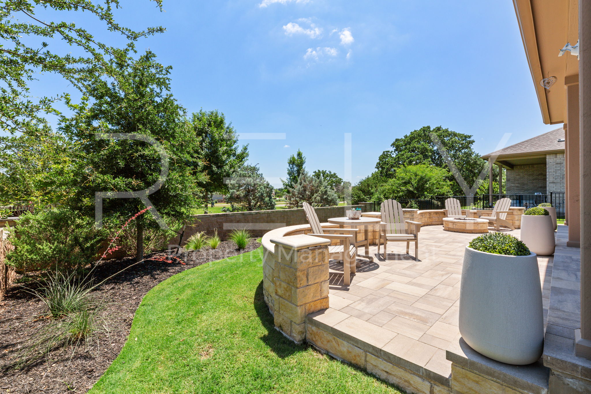 101 Spanish Star Street Georgetown, TX 78633 - Photo 38 of 39 An inviting stone patio offers an ideal setting for outdoor gatherings and relaxation.