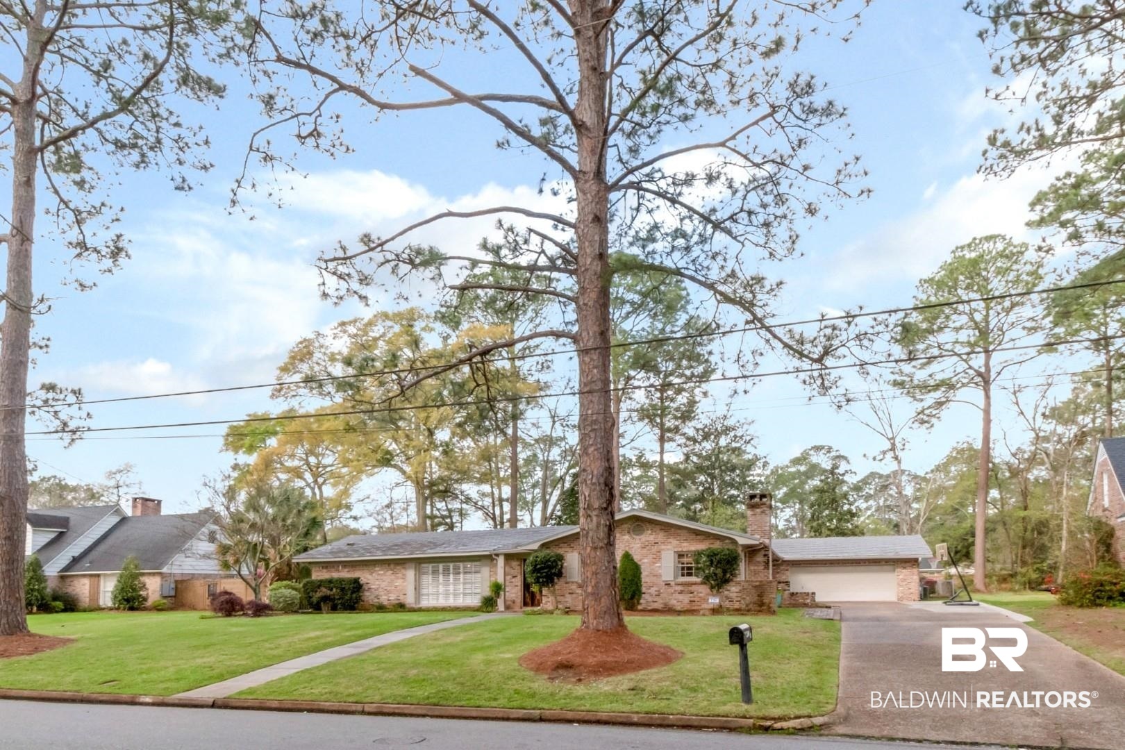 154 Fenwick Road Mobile, AL 36608 - Photo 46 of 48 Ranch-style house with a front lawn, brick siding, driveway, a chimney, and a garage