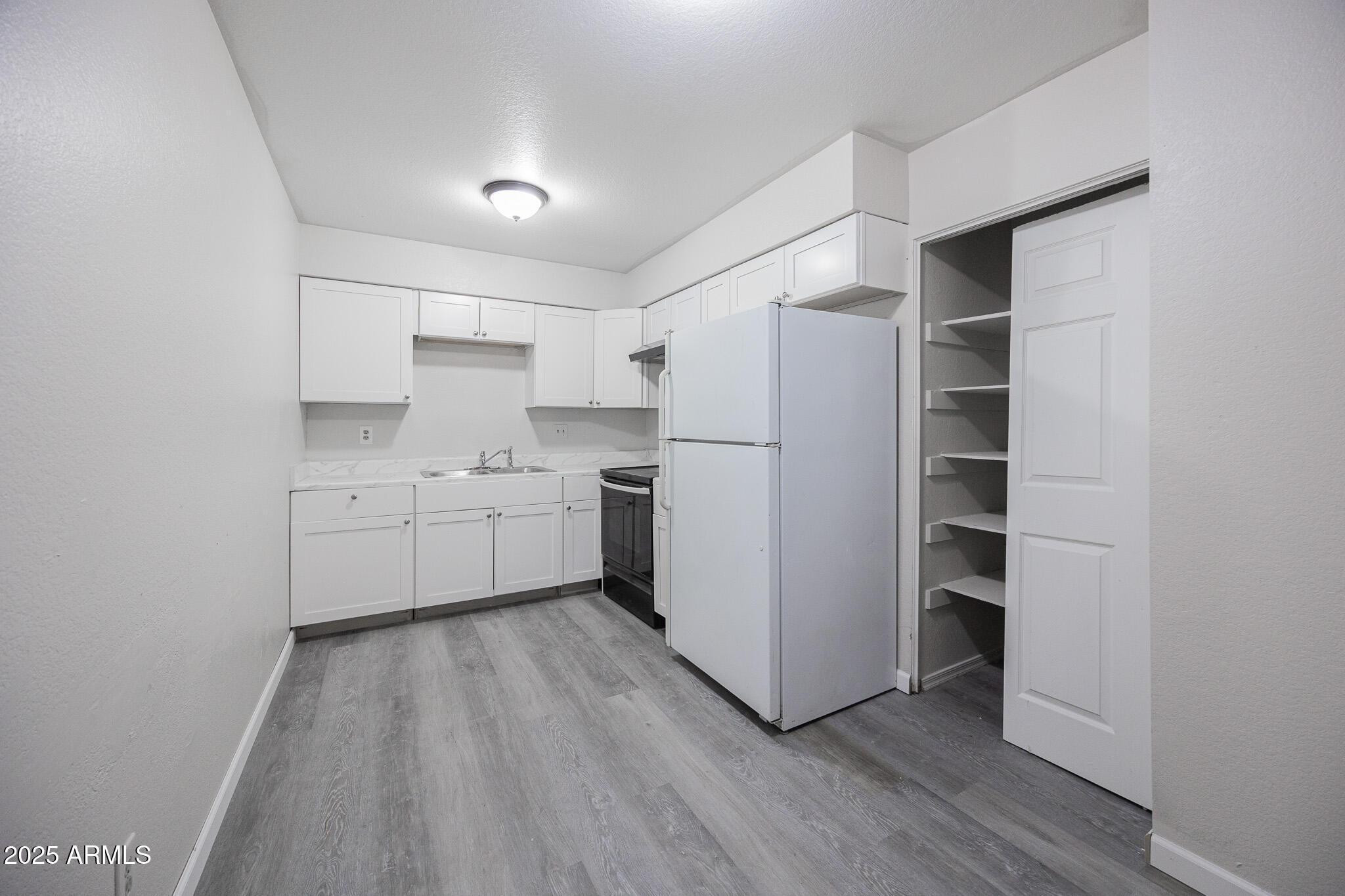 2340 East Broadway Road, Unit A Mesa, AZ 85204 - Photo 6 of 14 a utility room with cabinets washer and dryer
