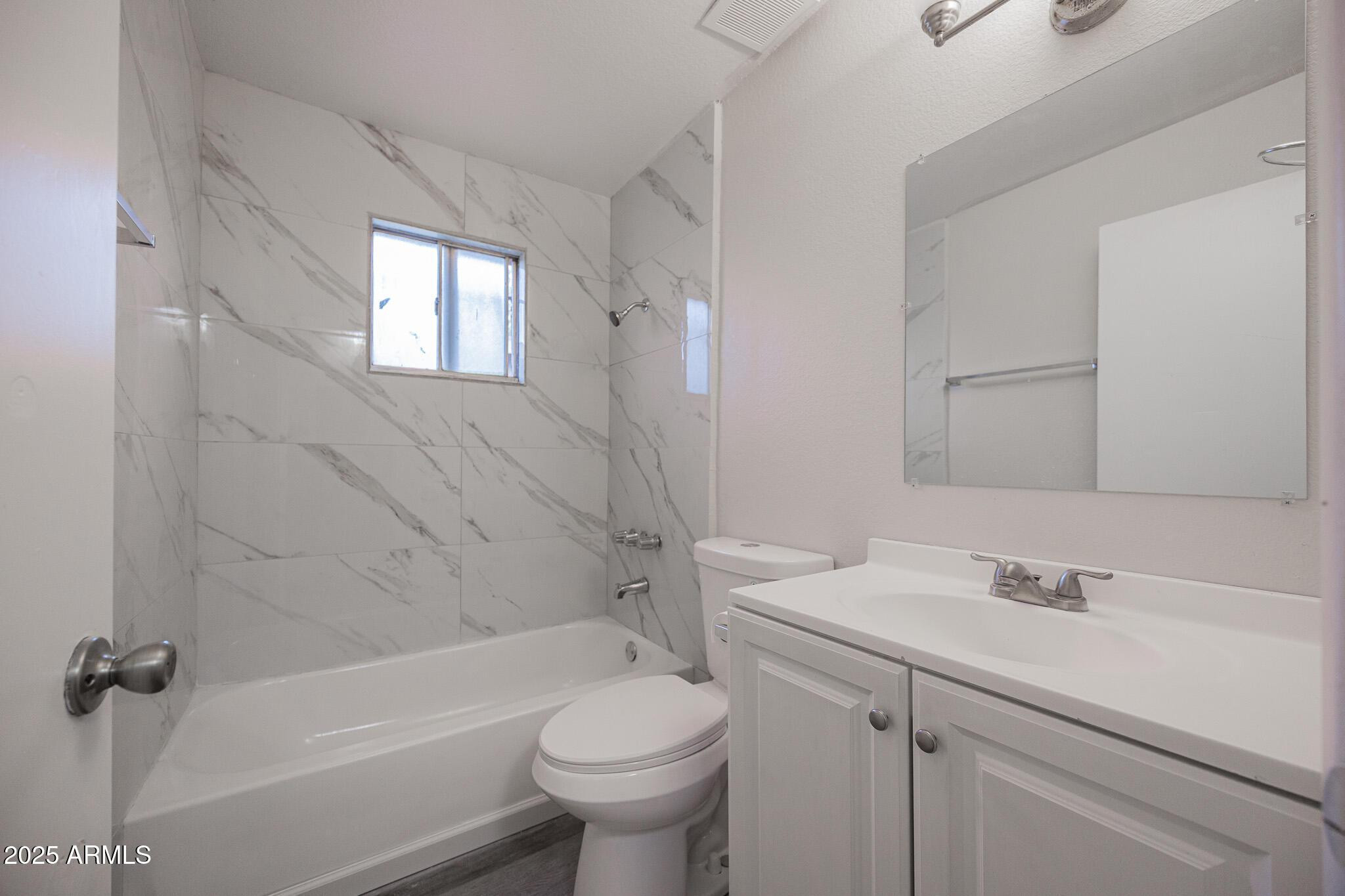 2340 East Broadway Road, Unit A Mesa, AZ 85204 - Photo 10 of 14 a bathroom with a sink toilet and shower